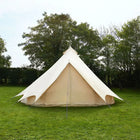 Beige Bell Tent Plus on grass with trees in the background