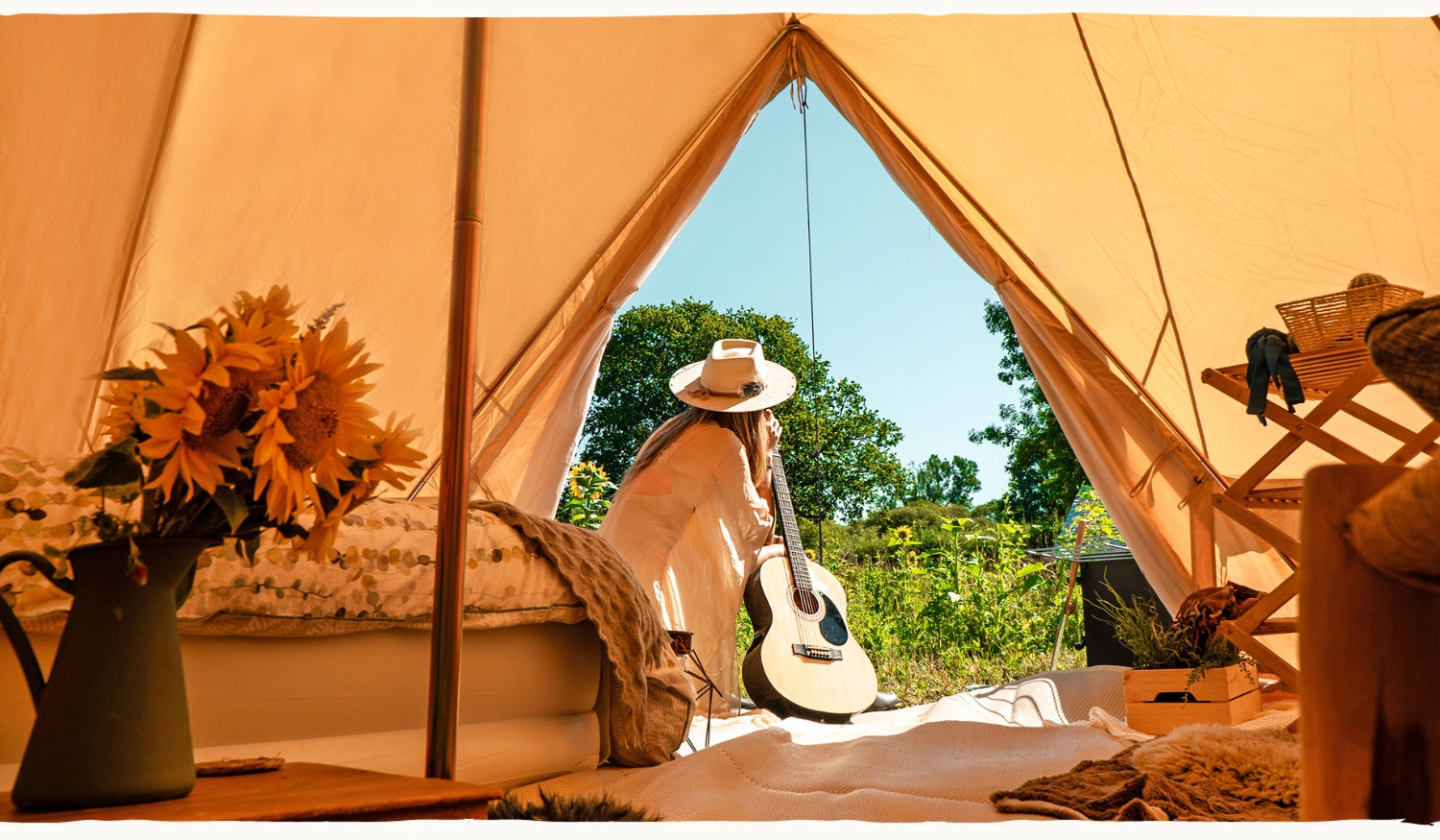 cosy boho bell tent interior. girl guitar