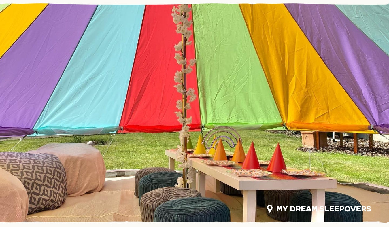 rainbow bell tent interior with sides rolled up