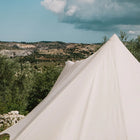 close up of the exterior back view of the tucana tent's centre pole with a mountainous terrain in the background