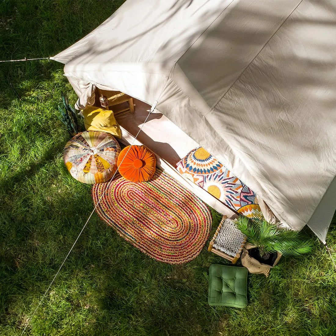 Vela Air Tent set in nature, featuring vibrant cushions and a cozy boho style – Glamping tent by Boutique Camping