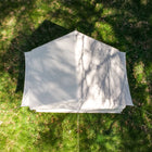 Overhead view of the Vela Air Tent pitched on grass, displaying its neat, compact footprint.