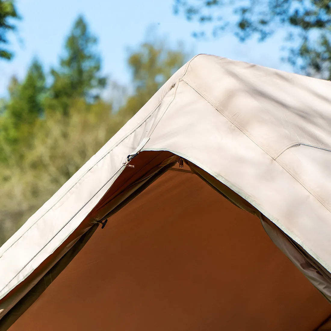 Close-up of the Vela Air Tent’s unzipped door seam and durable weatherproof fabric.
