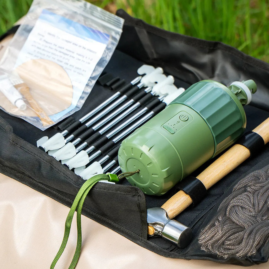 Close-up of the Vela Air Tent's packed bag and portable air pump kit, ready for set-up.