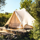 4m bell tent plus glamping tent on wooden decking surrounded by trees