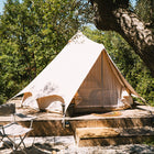 boutique camping bell tent plus glamping tent on wooden decking surrounded by trees