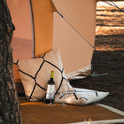 close up view of the bottom front of the luna bell tent doorway with pillows and a bottle of wine and glasses