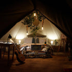 canvas star bell tent tipi boutique Camping glamping boho cosy interior with gutair