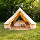 5m double door classic bell tent front entrance view pitched outdoors with glamping double bed setup 