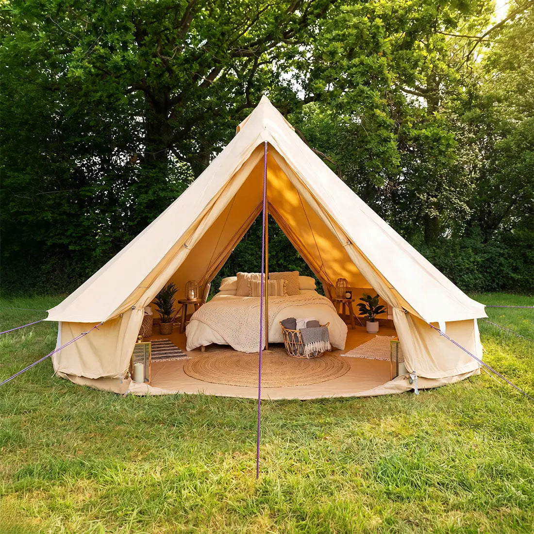 5m double door classic bell tent front entrance view pitched outdoors with glamping double bed setup 