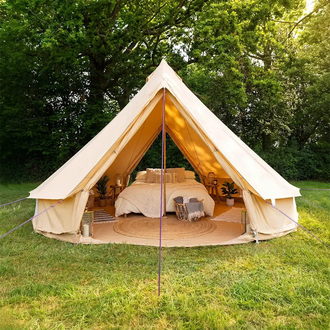 5m double door classic bell tent front entrance view pitched outdoors with glamping double bed setup 