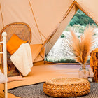 Bell tent plus glamping tent interior lifestyle setup with furnishings
