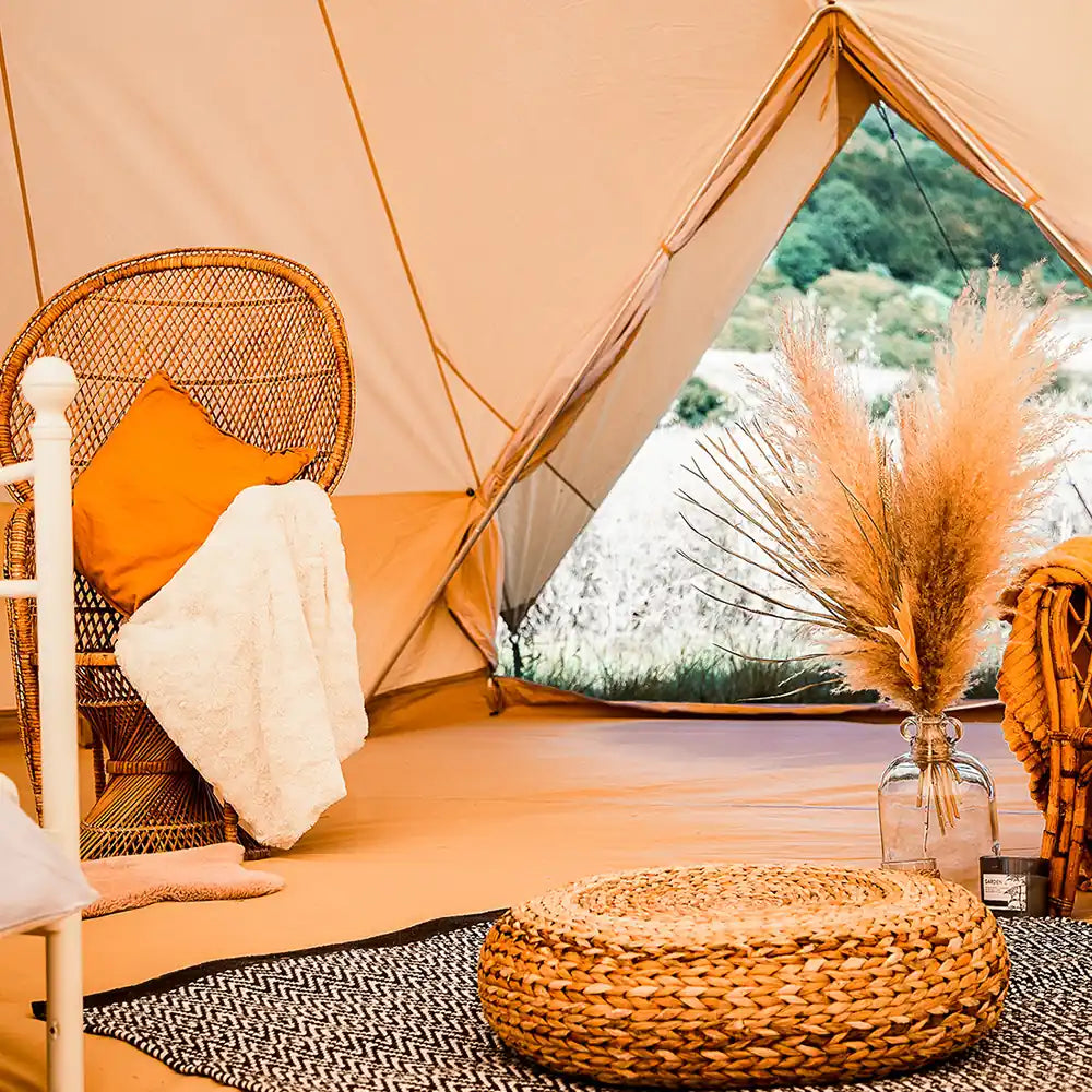 Bell tent plus glamping tent interior lifestyle setup with furnishings