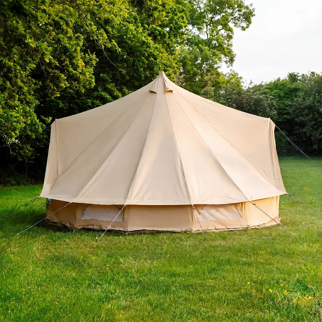 5m double door classic bell tent side view pitched on grass campsite
