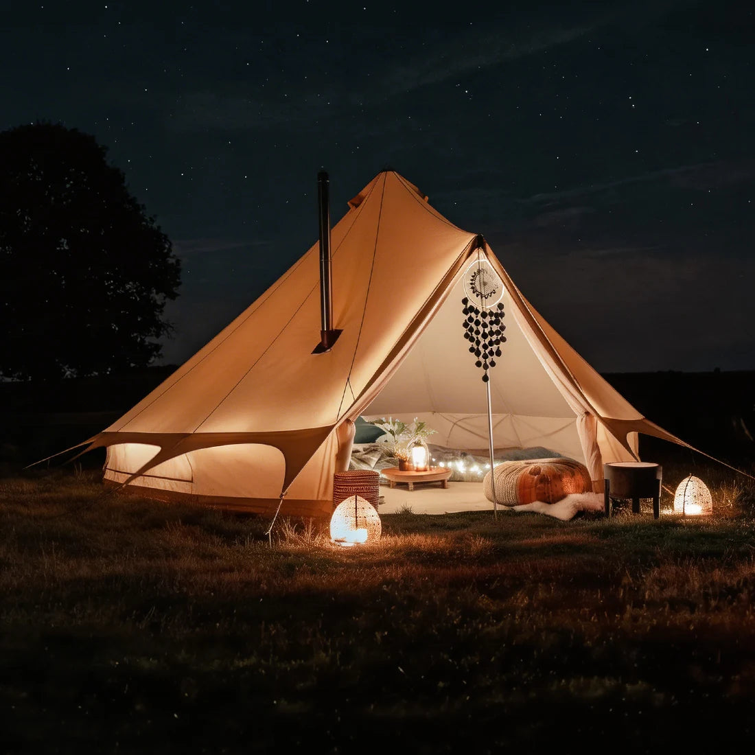 boutique camping bell tent plus glamping tent night time with stove flue