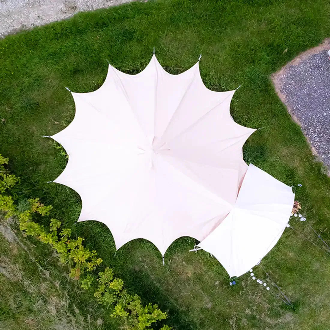 Bell tent plus glamping tent aerial top down view in garden