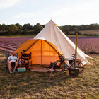 boutique camping star bell tent in lavender field with two men enjoying a beer in golden hour