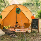 little boy outside of happy place boutique camping star bell tent