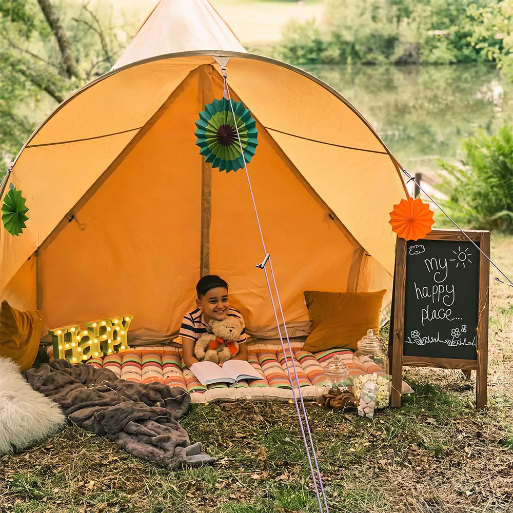 little boy outside of happy place boutique camping star bell tent