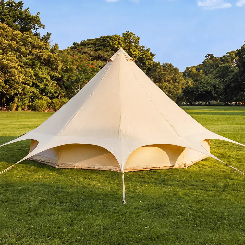 boutique camping star bell tent pitched on grass view from the back rear