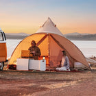 boutique camping star bell tent with couple at golden hour hanging outside of tent about to cook outdoor dinner