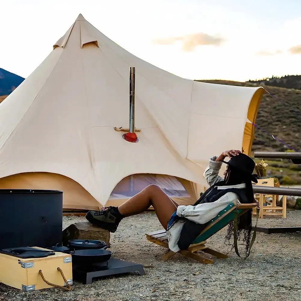 boutique camping hot tent star bell tent with with girl in deck chair and bstove inside tent