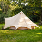 boutique camping star bell tent pitched on grass with integrated canopy