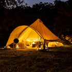 star bell tent lit up at night with creative set up