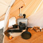 close up of boutique camping stove hole flap with hole in cotton fire retardant tent with cooking cast iron set