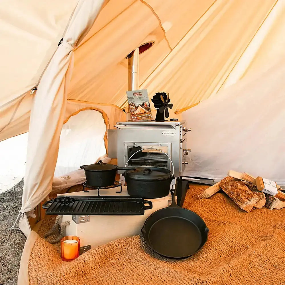close up of boutique camping stove hole flap with hole in cotton fire retardant tent with cooking cast iron set