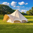 boutique camping star bell tent pitched on grass from side angle