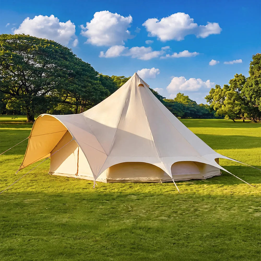 boutique camping star bell tent pitched on grass from side angle