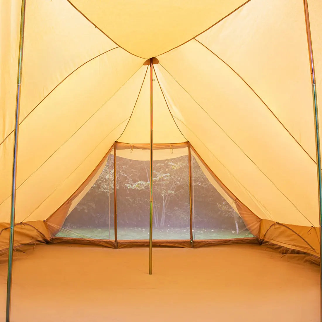 inside view of boutique camping tucana tent with a mesh window, showing a natural shadow landscape outside 