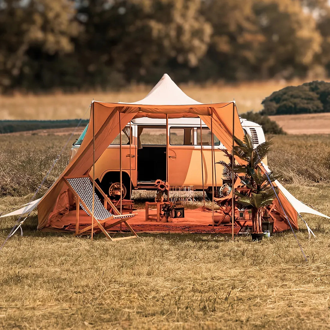 boutique camping double door tucana bell tent n a field attached to a vw campervan with trees in the background in a field 