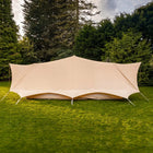 boutique camping sandstone tucana double door bell tent side view in grassy field