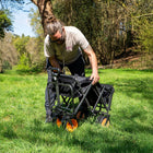 boutique camping electric camping wagon folded up in a green field