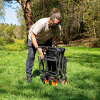 boutique camping electric camping wagon folded up in a green field