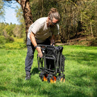boutique camping electric camping wagon folded up in a green field