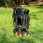 boutique camping electric camping wagon folded up in a green field