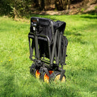 boutique camping electric camping wagon folded up in a green field