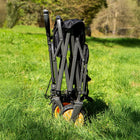 boutique camping electric camping wagon folded up in a green field