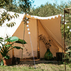 close up of the front door and canopy of the tucana tent, with plants and trees surrounding the glamping tent 