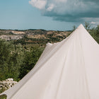 close up of the exterior back view of the tucana tent's centre pole with a mountainous terrain in the background