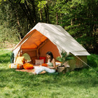 Vela Air Tent set up outdoors with colorful cushions and boho-style interior – Perfect for luxury glamping by Boutique Camping