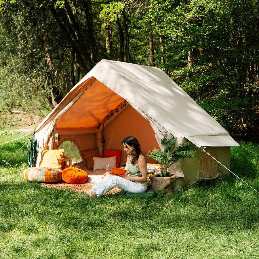 Vela Air Tent set up outdoors with colorful cushions and boho-style interior – Perfect for luxury glamping by Boutique Camping
